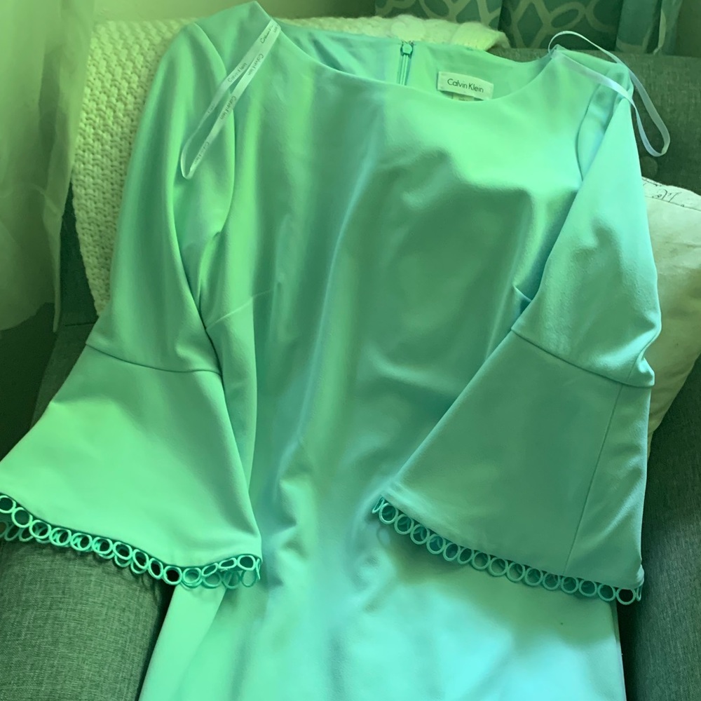Beautiful Aqua Dress with bell sleeves.
